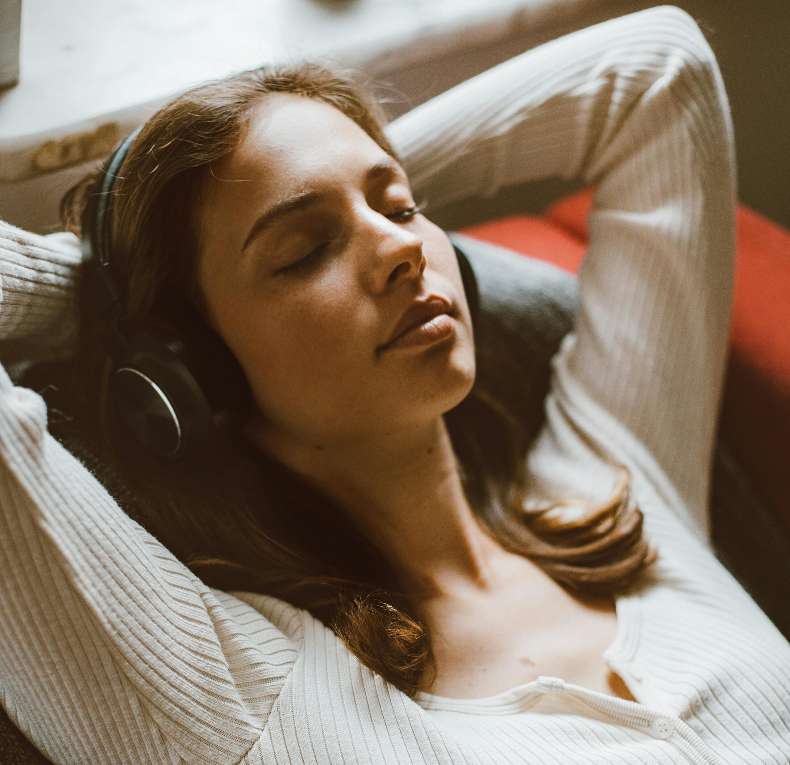Woman listening to Source & Signal Protocol™ MP3 | Woman relaxing with headphones on
